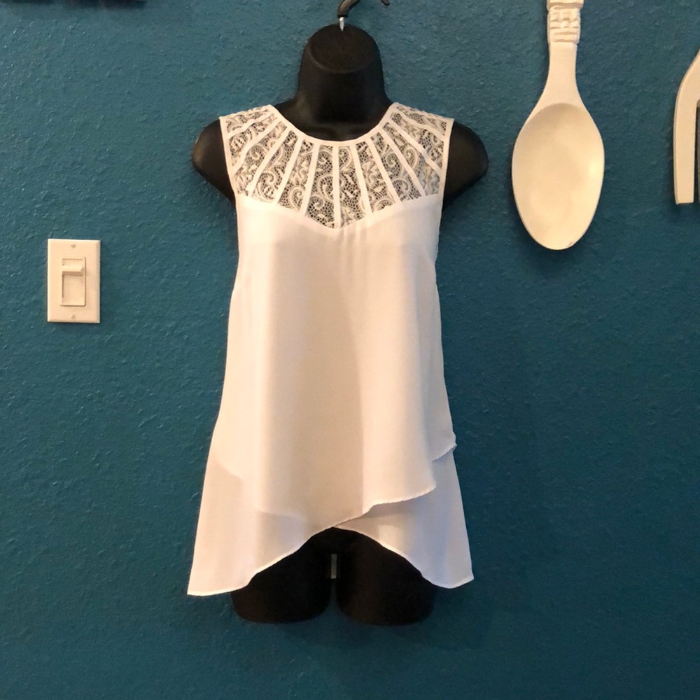 Sleeveless white top with lace